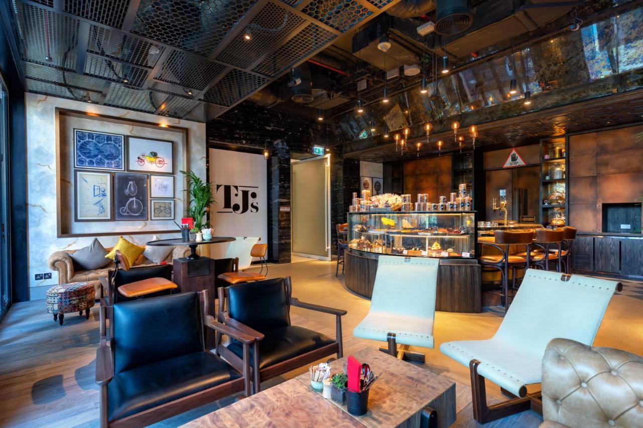 Taj Jumeirah Lakes Towers Hotel Dubai Exterior photo The interior of a Starbucks Reserve store in Shanghai, China